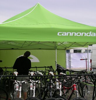 The "Cannondale" promotion tent is 4.5x3 m and green. The bicycles are placed under the folding gazebo.