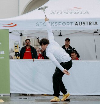 A white, printed folding gazebo from Ecotent's E2 series measuring 4.5 x 3 metres with side walls is used at a sports event organised by Stocksport Austria.